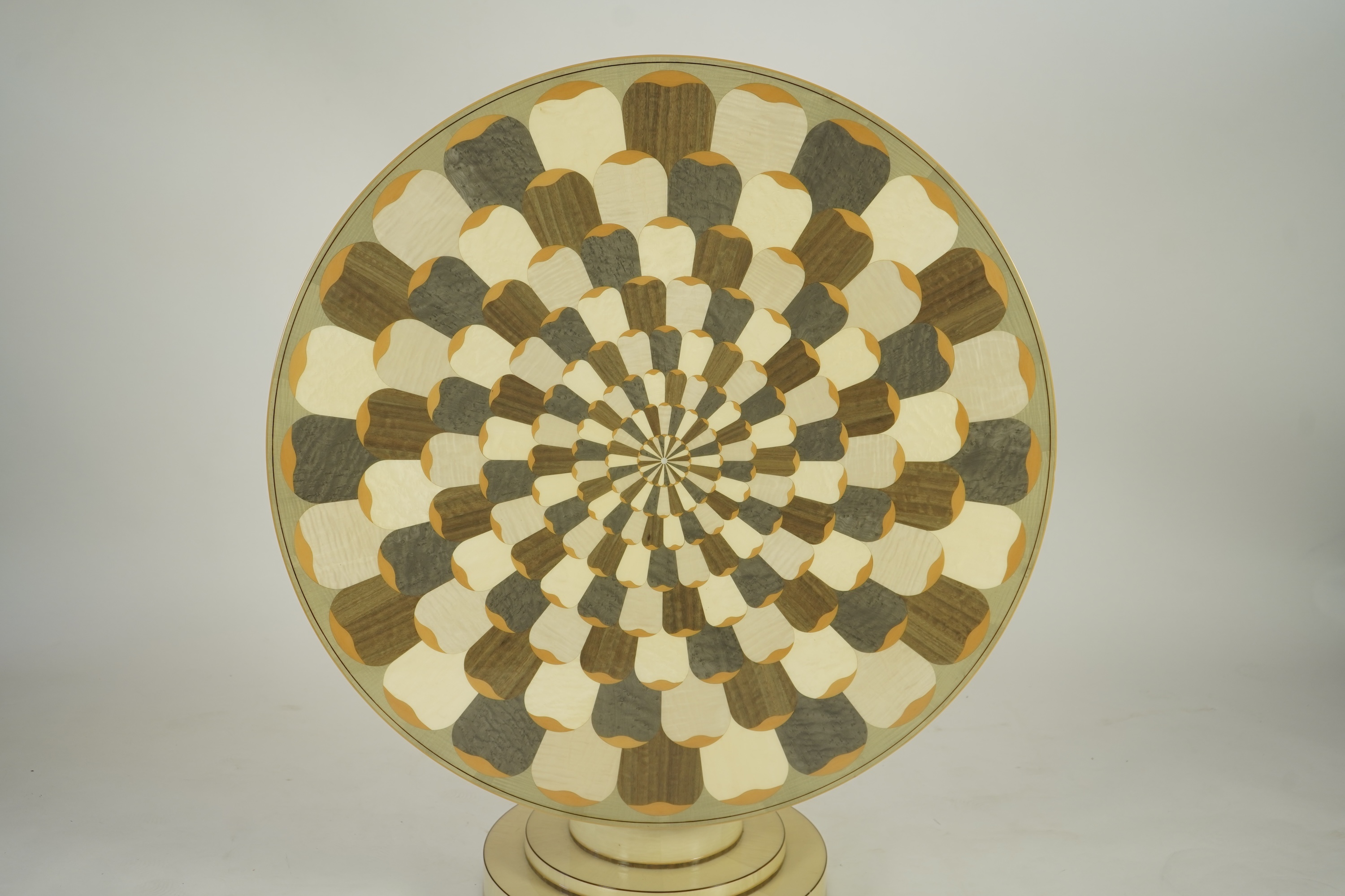 Lignae: A contemporary chrysanthemum and specimen wood inlaid circular tilt top centre table